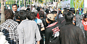 Firemen and rescue workers are caught under falling debris on March 14 