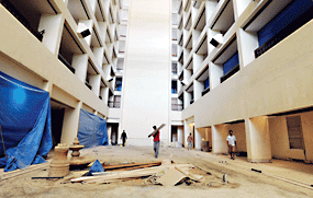 Workers renovate The Cinnamon Grand Hotel